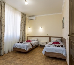 Номер стандарт с 2 односпальными кроватями без балкона в ТриО