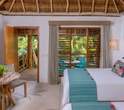 Четырёхместный номер Palapa с видом на сад в Shangri-la Caribe Beach Village Resort