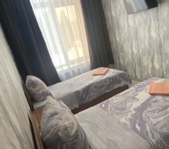 Номер стандарт с 2 односпальными кроватями (удобства на этаже) в Постоялый двор