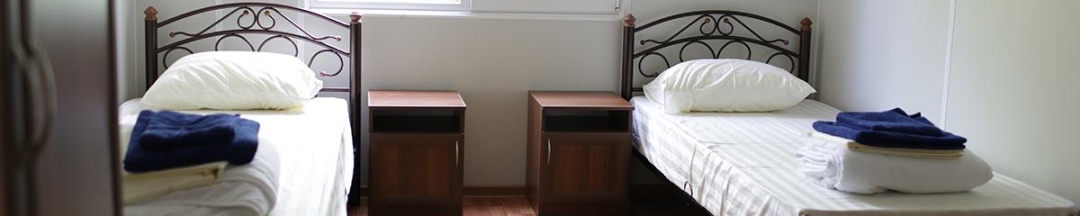 Номер стандарт с 2 односпальными кроватями (удобства на этаже) в Южный причал