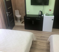 Комната стандарт семейная с 2 двуспальными кроватями в Сан бах, гостевой дом